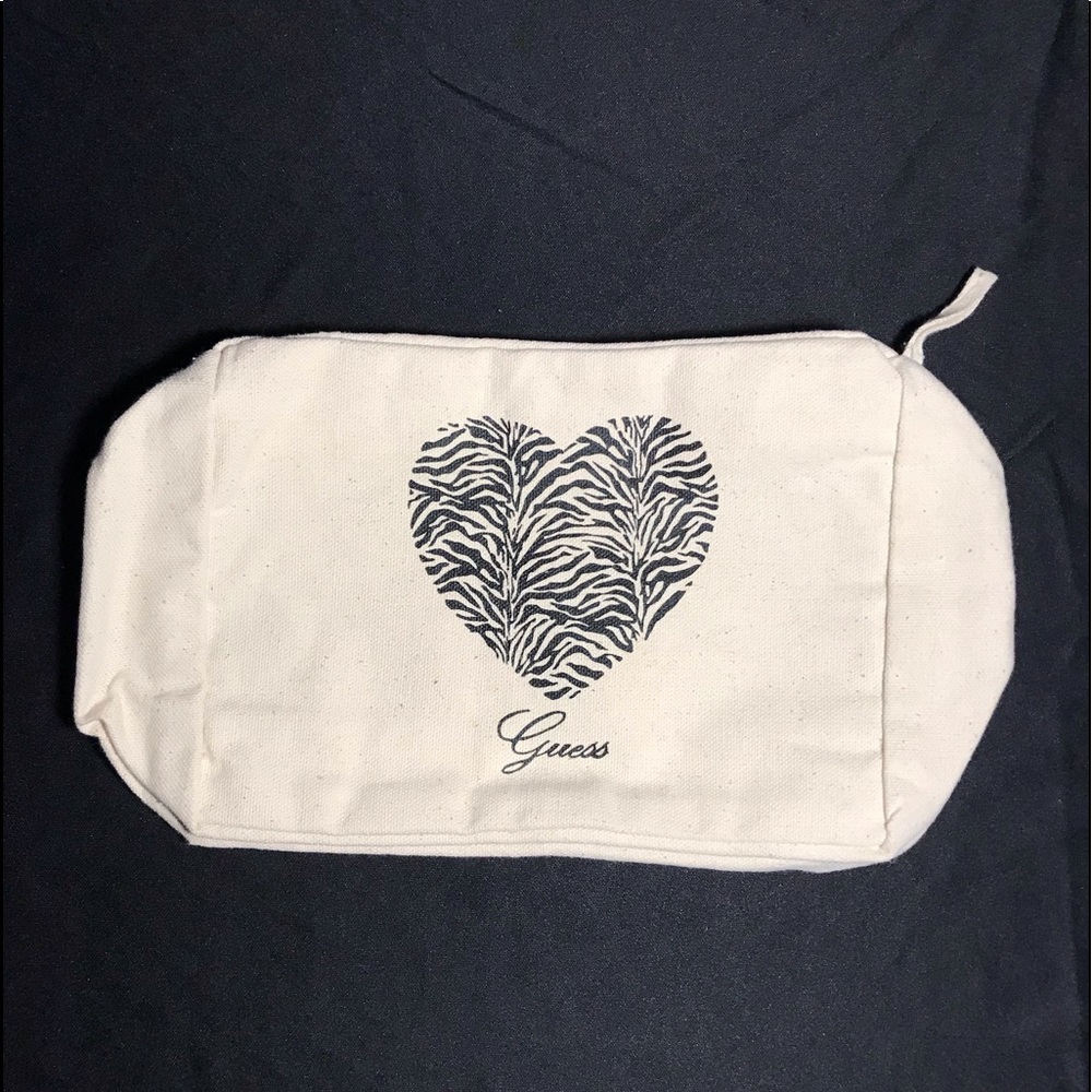 New guess brand canvas make up pouch.
